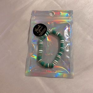 Light green and dark green and white clay bead bracelet